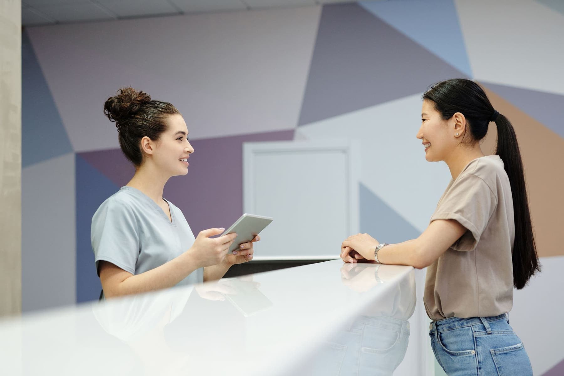 Student talking to a training centre receptionist