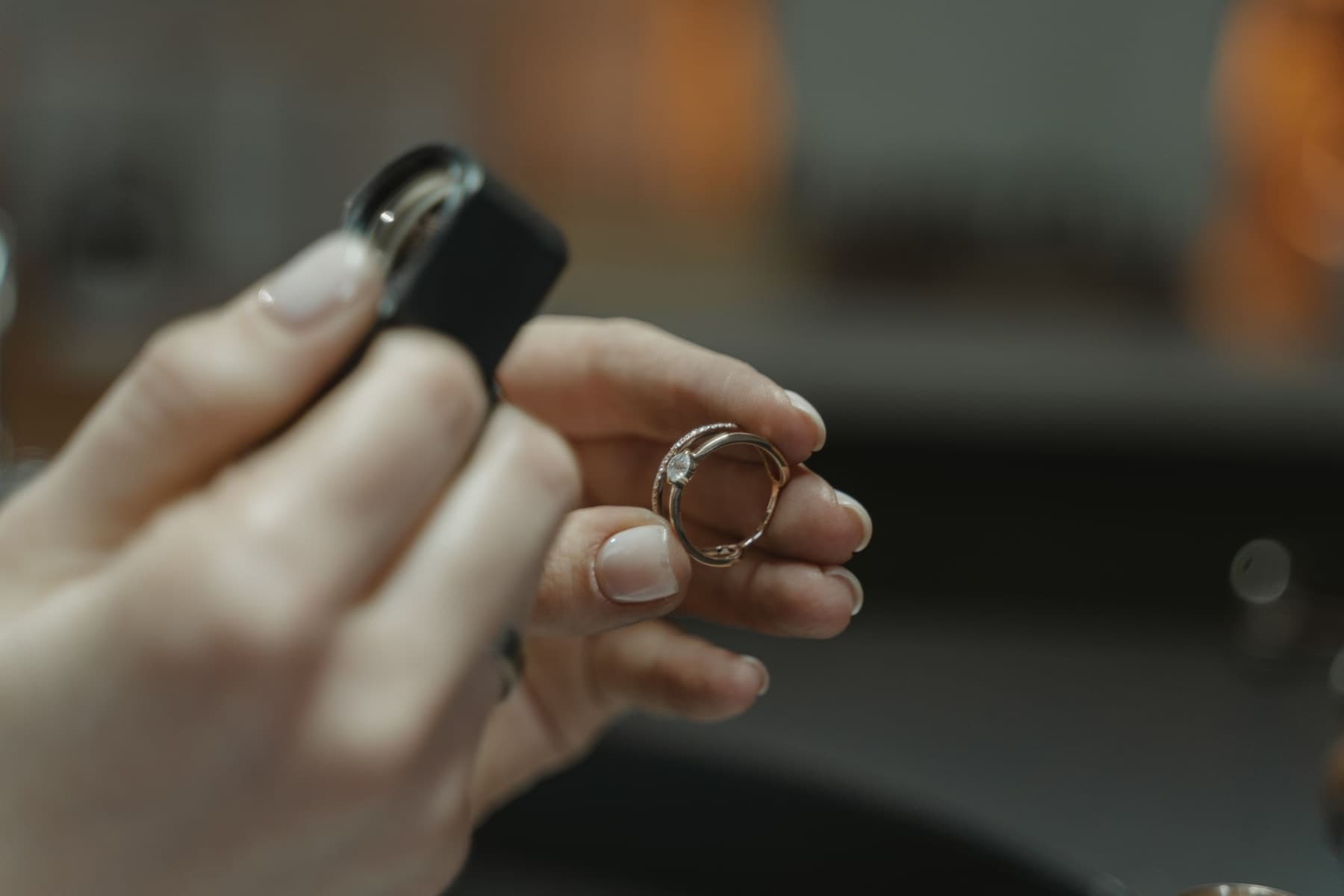 Jeweller inspecting a gold ring with a loupe