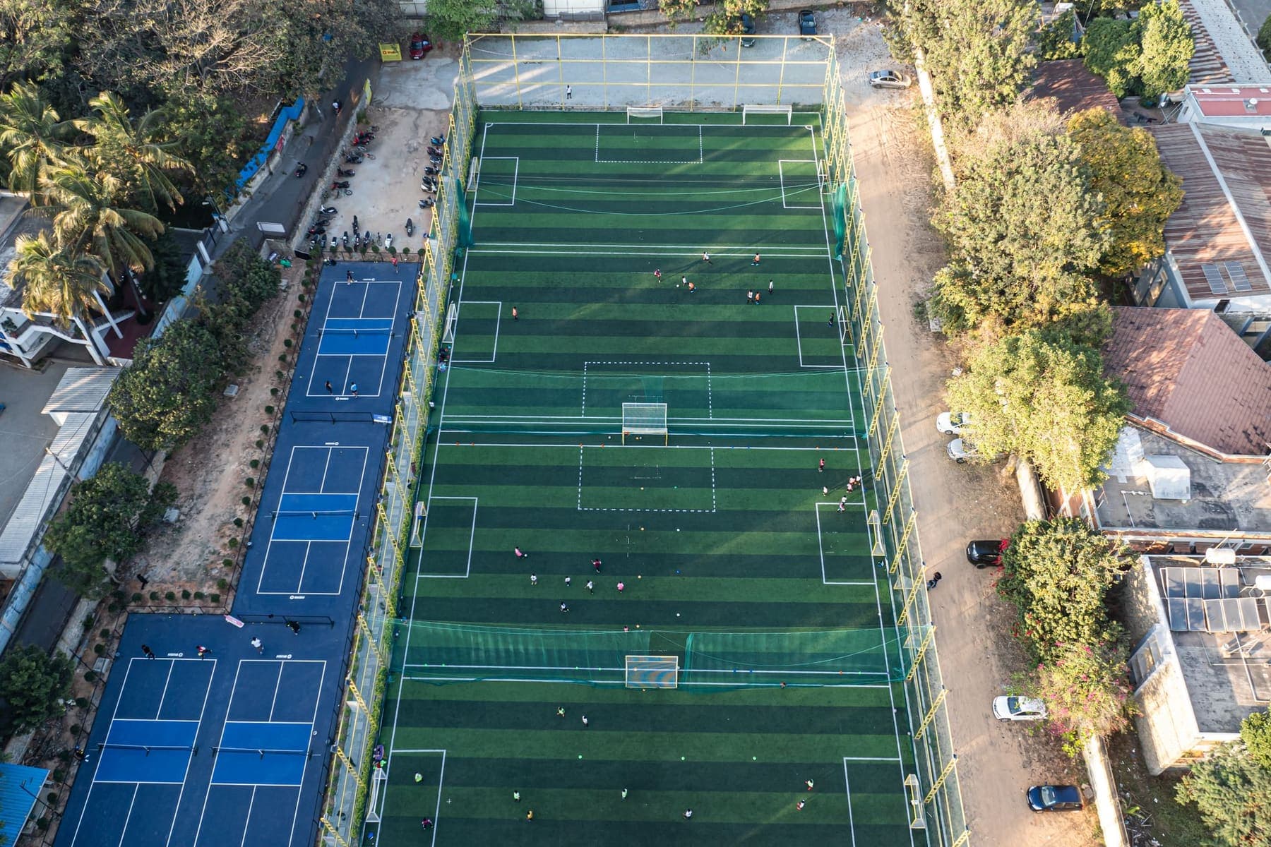Aerial view of a cluster of artificial-turf mini pitches
