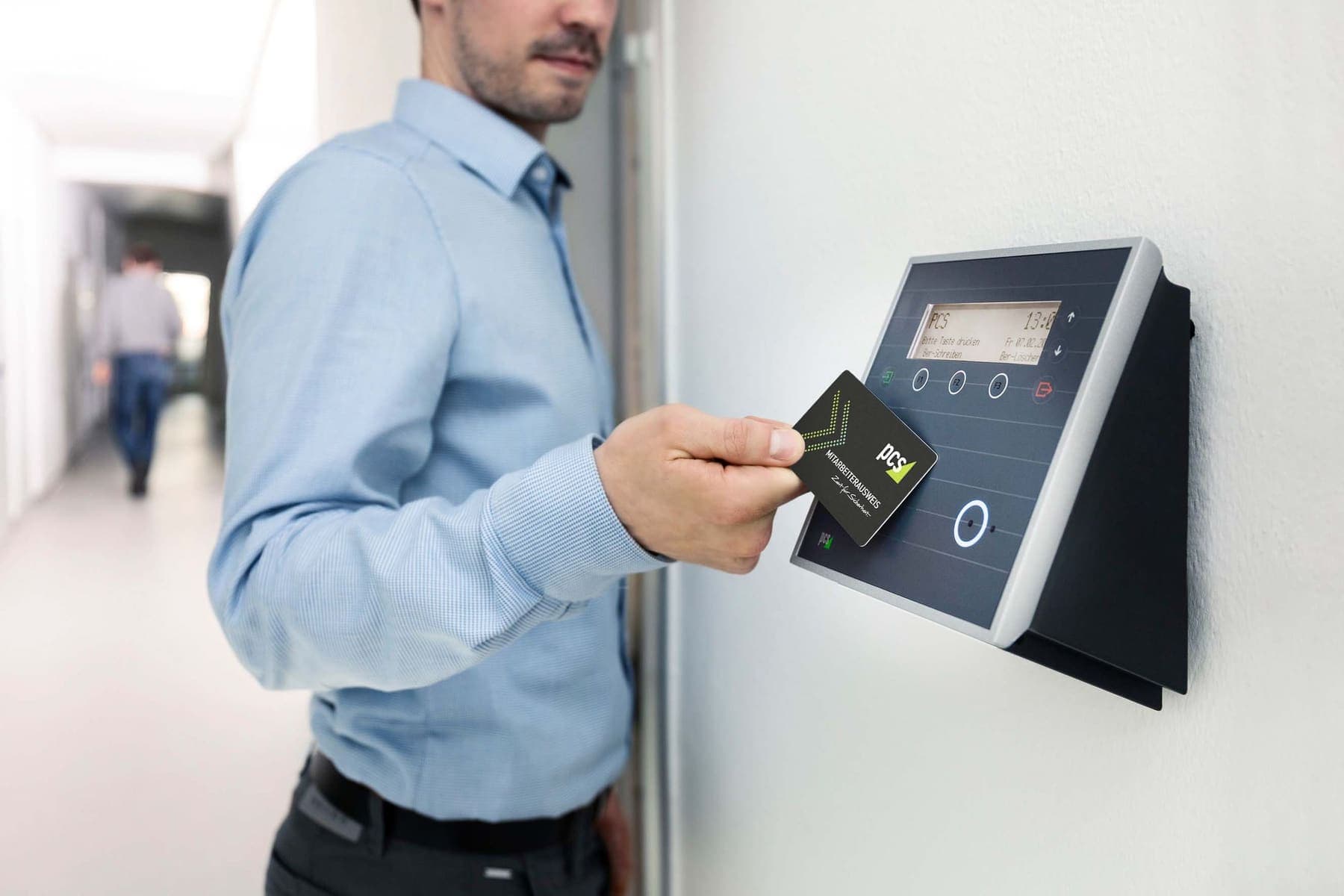 Employee tapping an access card on a reader