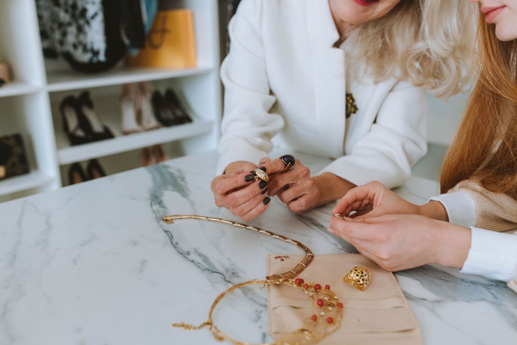 Jewellery staff showing a ring to a customer