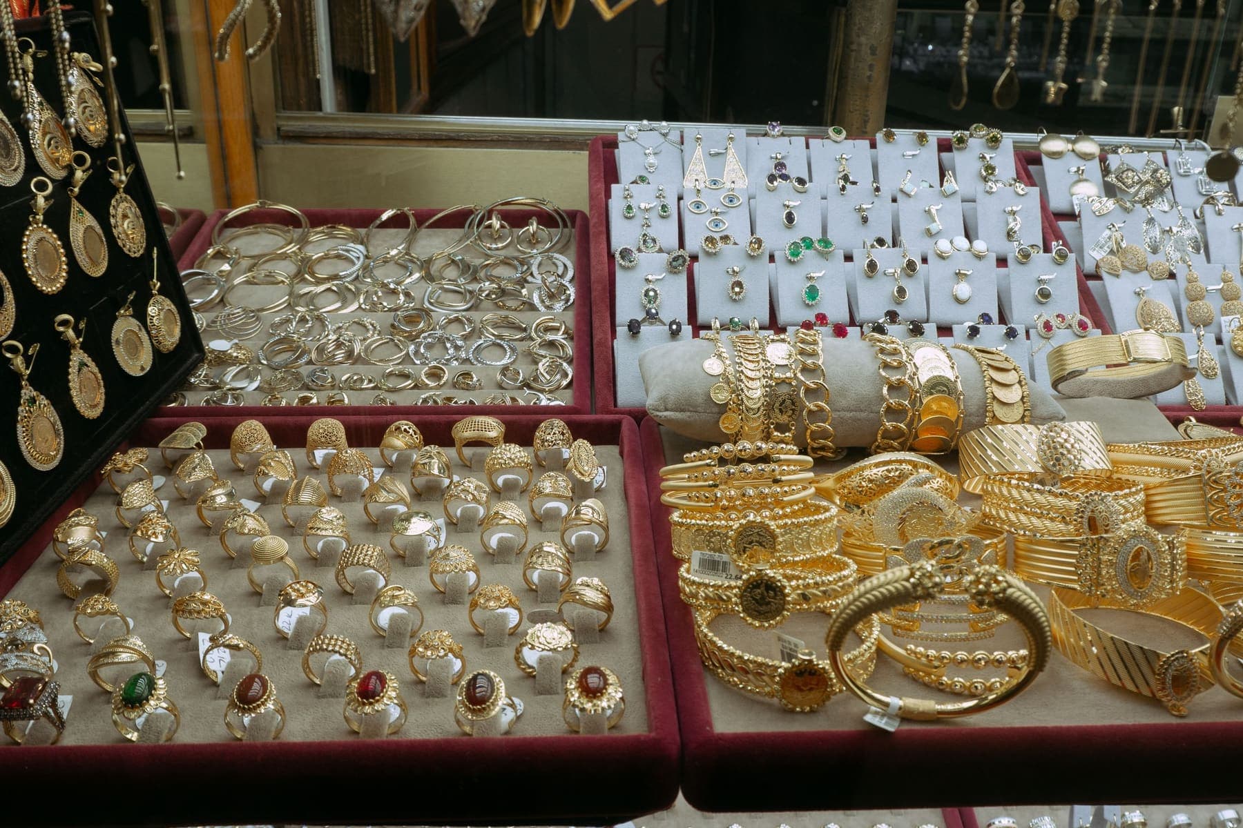 Display case with gold rings, bangles and earrings