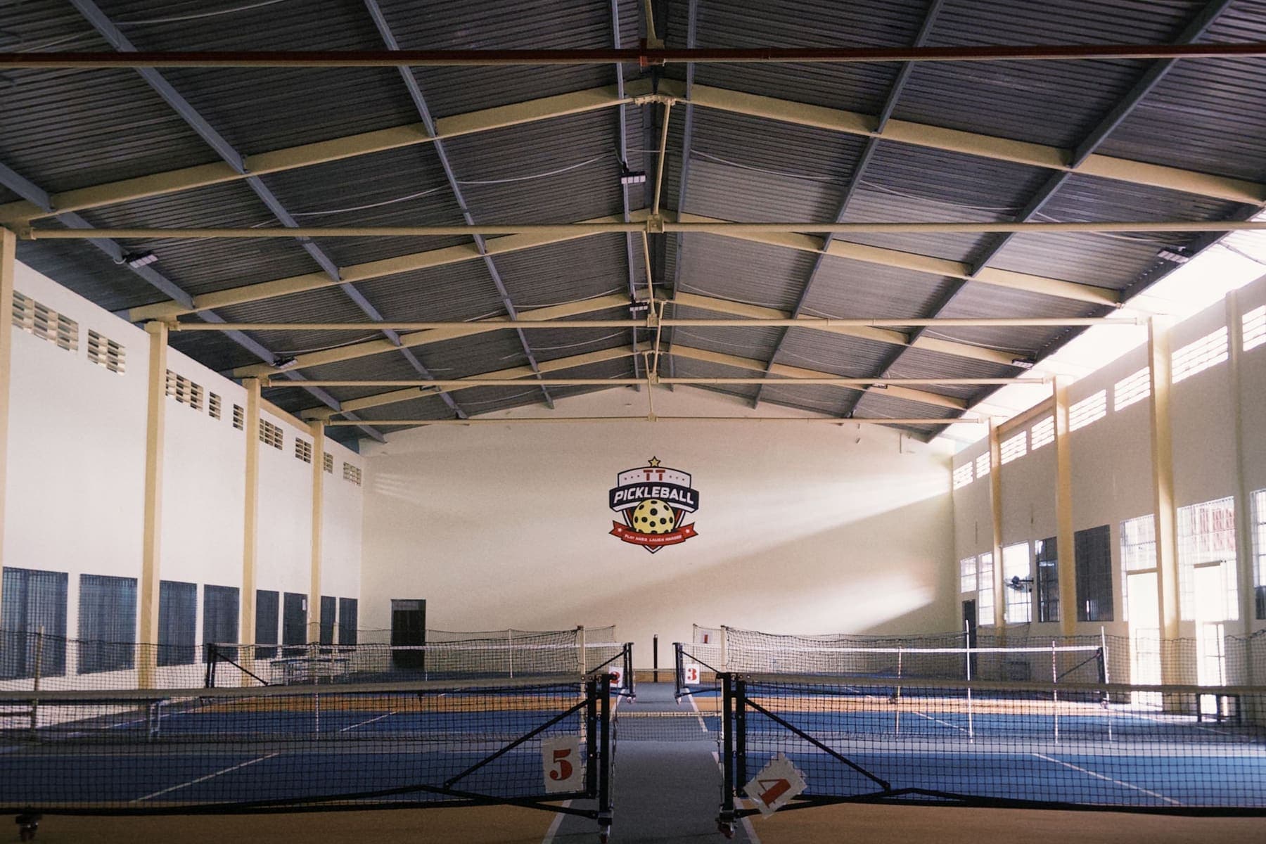Bright modern indoor pickleball courts